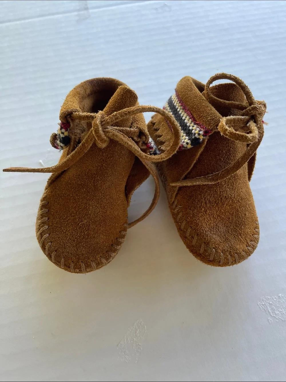 Minnetonka Brown Suede Kids Moccasins with Woven Trim